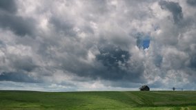 Cumulus Clouds Move Across The Sky Over An Abandoned Farmhouse In Tornado Alley Before A Severe Weather Outbreak  - Powered by Shutterstock - Get 15% off with code: PIKWIZARD15
