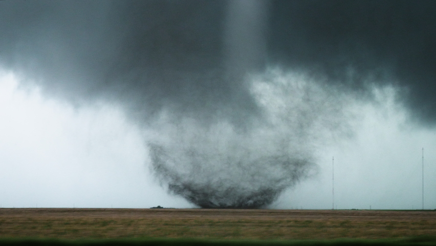 A Tornado Churns In A Field During a Severe Weather Outbreak In Tornado Alley | Shutterstock HD Video #1073542139