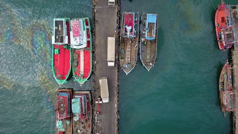Aerial view of fisherman dock which has many ships anchoring for transport seafood and supplies inland