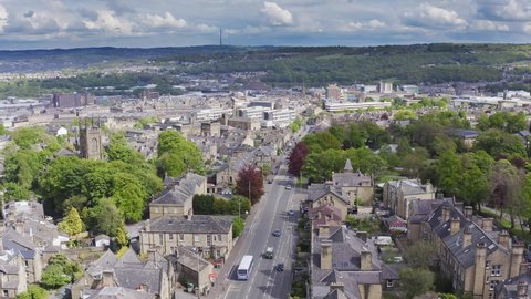 Aerial drone shot rising over Huddersfield historic English town in Yorkshire