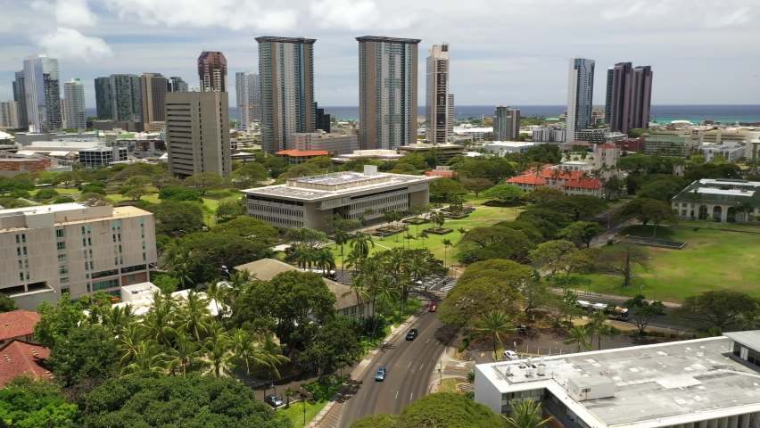 Cinematic 4K birdseye drone footage of Honolulu City Hall and downtown Honolulu, a Polynesian, Pacific Island tourist destination on Oahu island in Hawaii known for its surfing and beaches
