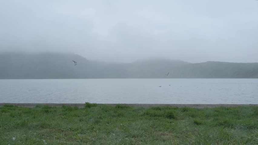 Hiking Along a Misty Lake