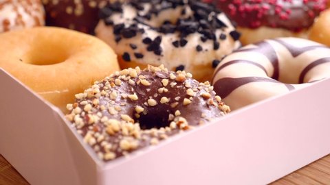 Assortment of donuts of different flavors in a box. 
