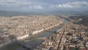 drone flying up above the florence roofs, rivers and bridges with panoramic view