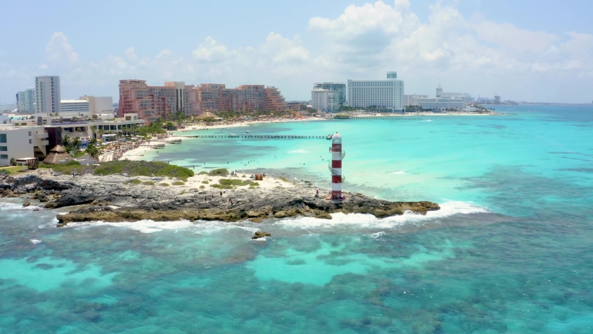 Beautiful aerial view of the beaches in Mexico near Cancun and Playa Del Carmen towns. Flying over luxury hotels, turquoise blue water and palm trees.