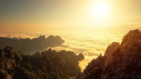Sunrise time lapse looking out over a sea of fog at the Yellow Mountains (Huangshan) in China
