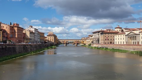 Hyperlapse Ponte Vecchio, medieval stone bridge over of Arno river at clear summer day in Florence, Italy.