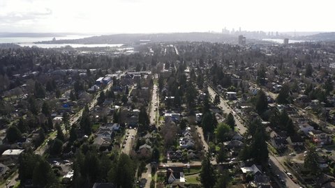 Cinematic aerial drone clip of Ravenna, Pontiac, Northeast Seattle, Roosevelt, Bryant, University District, Hawthorne Hills, Windermere, affluent Seattle suburbs between the I-5 and Lake Washington