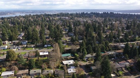 Cinematic aerial dolly footage of Ravenna, Pontiac, Northeast Seattle, Roosevelt, Bryant, University District, Hawthorne Hills, Windermere, affluent Seattle suburbs between the I-5 and Lake Washington