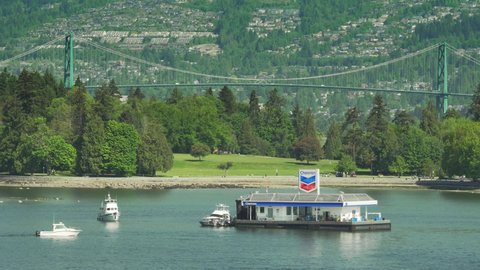 Vancouver, British Columbia, Canada - May 21, 2021: Historical Gas station overlooks Stanley Park at Coal Harbour.