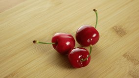 Cherry fruits rotate. Close up with copy space. 4k video.