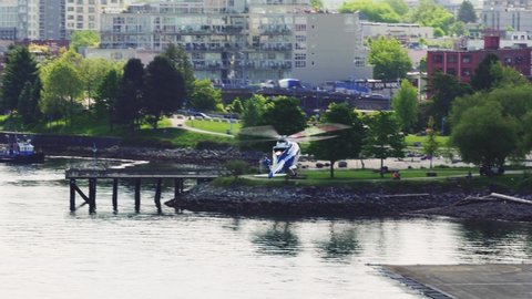 Vancouver, British Columbia, Canada - May 21, 2021: Vancouver Harbour Heliport early morning arrival. 