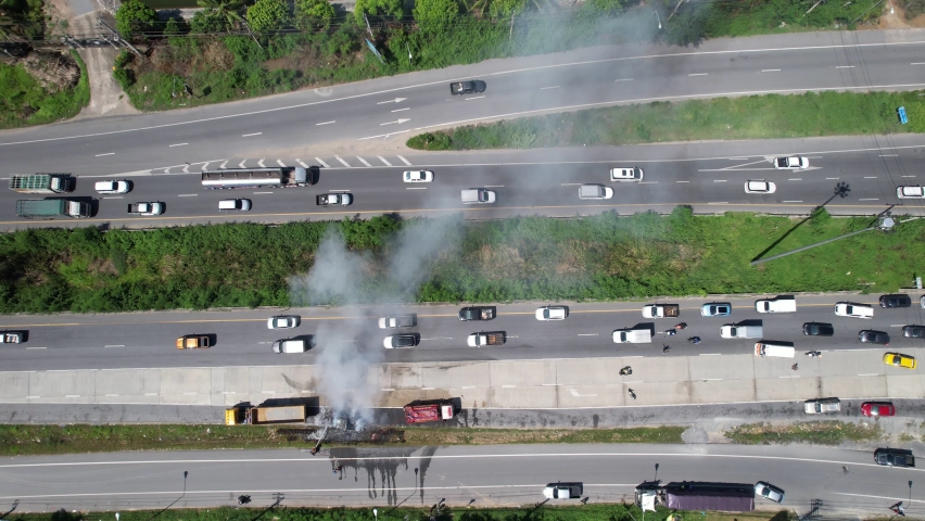 Aerial View: Rescue Team of Firefighters and Paramedics Work on a Car Crash Traffic Accident Scene.