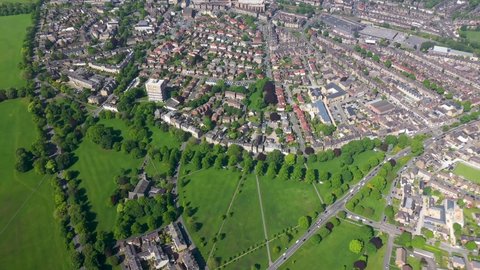 Aerial footage of the British town of Harrogate, a town in North Yorkshire, England, east of the Yorkshire Dales National Park in the summer time showing residential housing estates