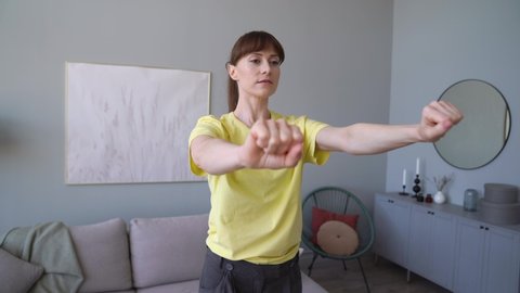Young Woman is Doing Physical Therapy Hand Exercises At Home. Close-up of Hands