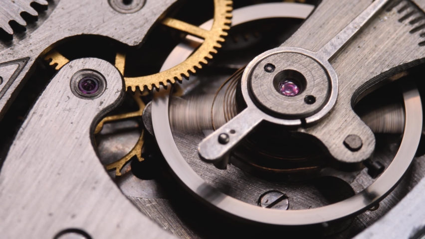 Mechanical watches with gears and cogs. Watch or clock mechanism. Time or work concept. Clockwork details and parts | Shutterstock HD Video #1073637770