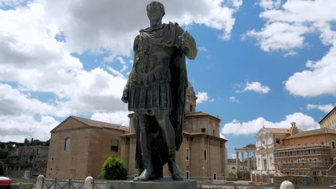 Bronze statue of emperor Julius Caesar along Via dei Fori Imperiali at the Roman Forum in Rome, Italy