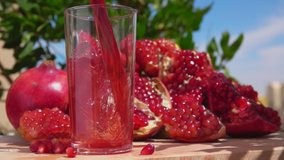 Freshly squeezed pomegranate juice wave is flowing into a jug in slow motion - Powered by Shutterstock - Get 15% off with code: PIKWIZARD15