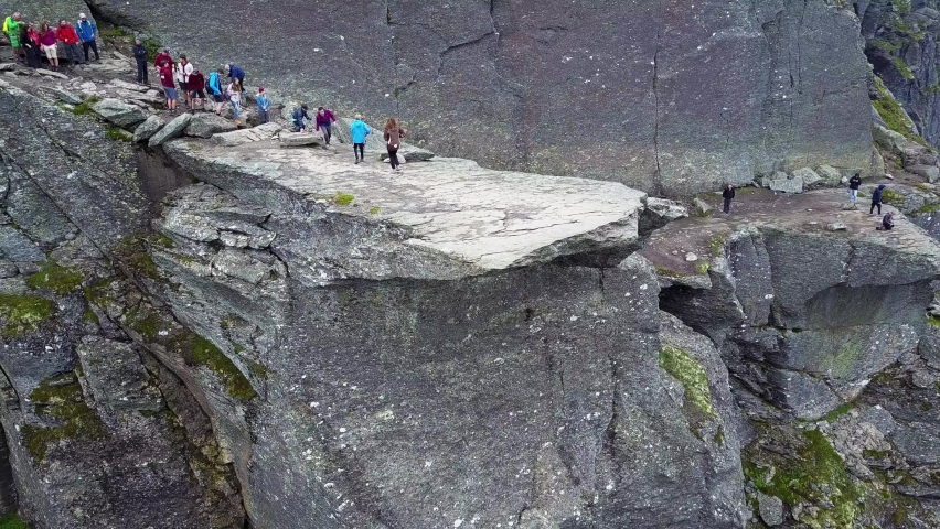 Trolltunga or Troll Tongue aerial view, a rock formation at the Hardangerfjord near Odda town in Hordaland, Norway Royalty-Free Stock Footage #1073649599