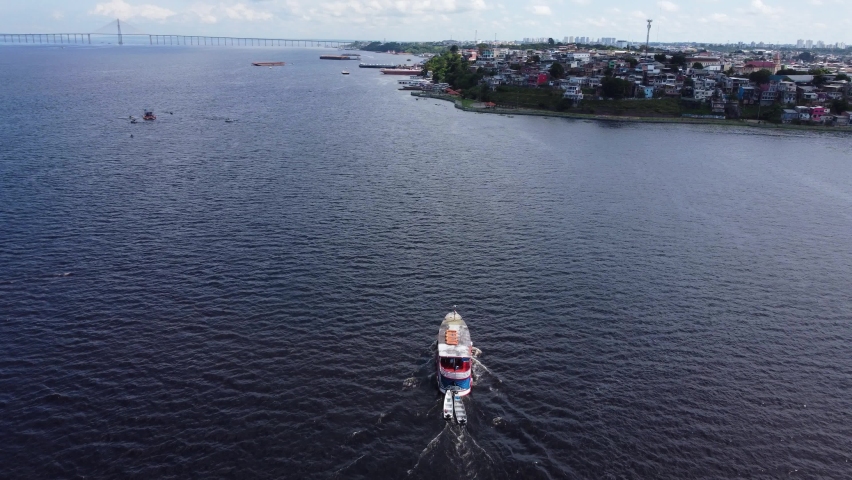 Boat navigates by the Negro River near the Port of Manaus, Amazonas state, Brazil.