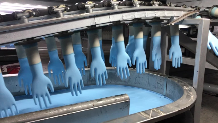 Rubber gloves production line in the rotation Royalty-Free Stock Footage #1073663894
