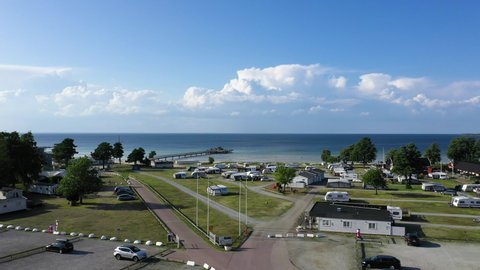 Aerial drone camping campers camp site Sweden Swedish vacation beach resort visit tourist tourism country sunny travel destination spend money holiday enjoying life senior family traveling summer park