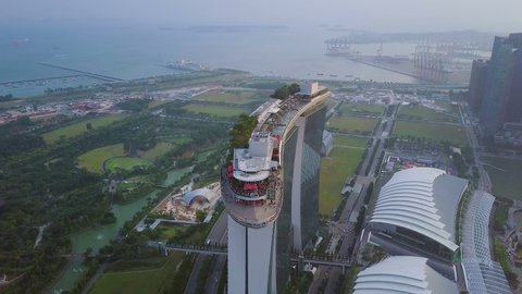 Singapore , Singapore - 01 04 2018: Drone shot of roof top of Marina Bay in Singapore on sunset