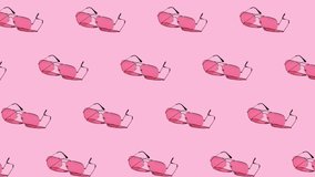 seamless looping animation of pattern with pink sunglasses on a pastel purple background. hard shadows from the sun at noon. leisure, travel and entertainment concept with copy space - Powered by Shutterstock - Get 15% off with code: PIKWIZARD15