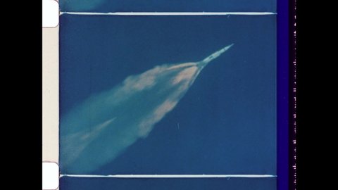 1969 Cape Canaveral, FL. Photographed with High Powered Lens Apollo 11 Spacecraft flys into Outer Space. The Three Stages of the Rockets Can Be Seen. 4K Overscan of Vintage Archival 16mm Film Print