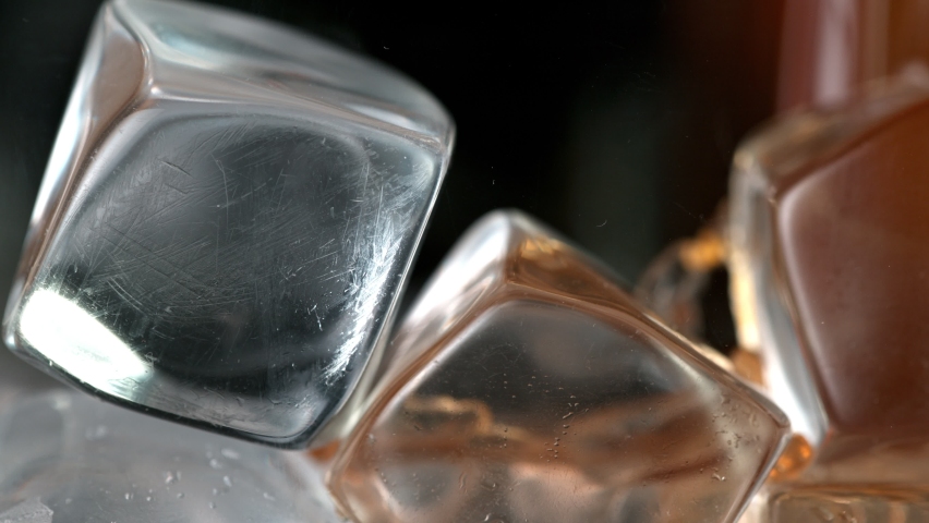 Super Slow Motion Detail Shot of Pouring Ice Coffee into Glass with Ice Cubes at 1000 fps. | Shutterstock HD Video #1073689406