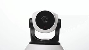 Surveillance IP Internet CCTV camera system remotely operated. Smartphone controlled home security camera moving filming around in 4k footage isolated on white background.
