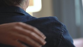 Comforting hand on shoulder of man - Powered by Shutterstock - Get 15% off with code: PIKWIZARD15