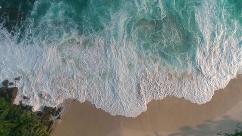 Aerial view video from the drone to the beach and ocean "Police Beach" strong raging waves breathtaking and rich blue ocean with snow-white waves, Seychelles.