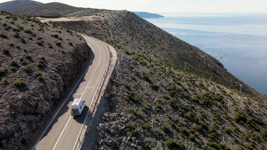 Vacations on the road. Solitary camper driving coastal road, Cres Island, Croatia | Shutterstock HD Video #1073744258