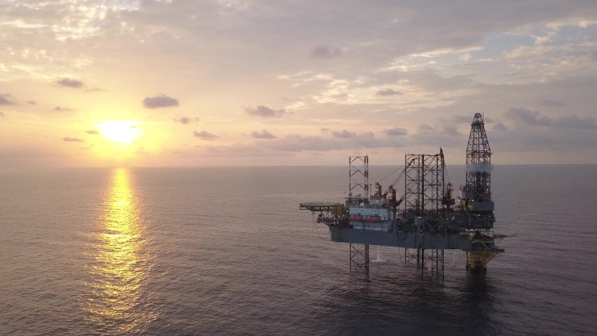 Aerial view of offshore jack up drilling rig during sunset - oil and gas industry
 Royalty-Free Stock Footage #1073756171