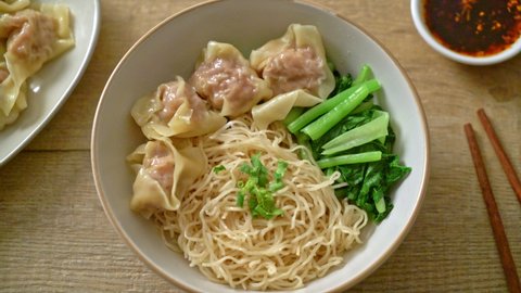 dried egg noodles with pork wonton or pork dumplings without soup Asian food style