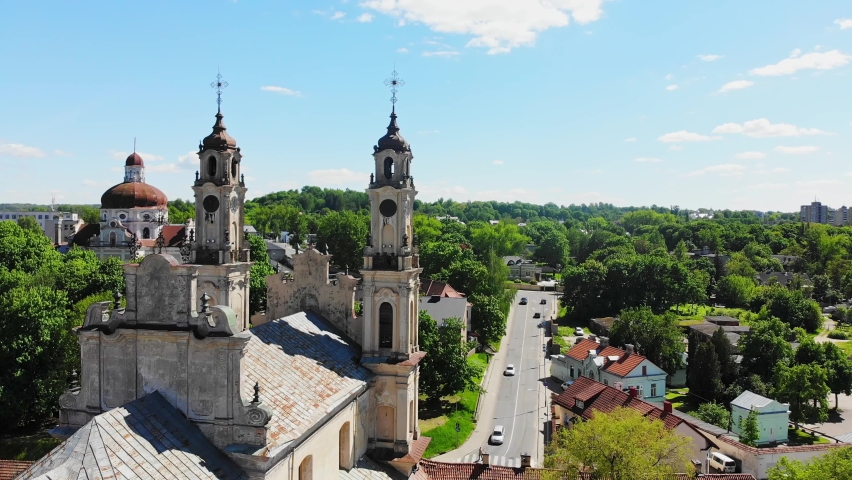 Aerial static view abandoned Church of ascension in capital city Vilnius with street view panorama. Historical landmark attraction destination. Unesco heritage sites Lithuania. Royalty-Free Stock Footage #1073761919