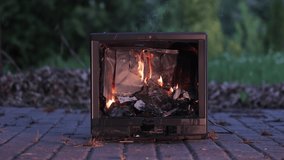 Burning fire in an old broken TV set, toxic air pollution from burning plastics of tube CRT television, 4k 60p footage - Powered by Shutterstock - Get 15% off with code: PIKWIZARD15