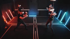 Group of happy joyful people VR headset glasses gaming together. Virtual reality happiness simulation studio. Oculus vrs game gadget helmets fun. Person joy. Groups vr-gamers  neon red blue background - Powered by Shutterstock - Get 15% off with code: PIKWIZARD15