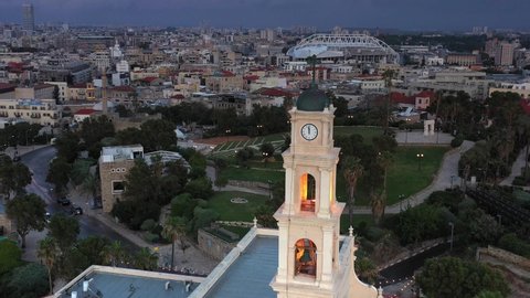 Aerial view over Jaffa Church and tel Aviv Skyline Sunset, 
Drone view from Jaffa and tel aviv Beach at beautiful sunset, 2021
