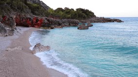 Early morning on Apelistra beach, Himare location. Astonishing spring scene of Albania, Europe. Impressive seascape of Adriatic sea. Beauty of nature concept background. Full HD video (High Definition