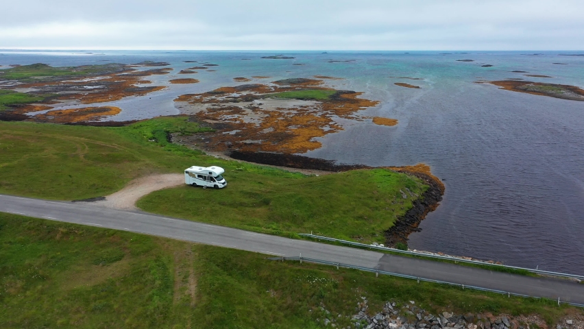 Aerial view of RV parked at a road. on the shore of Andoya, overcast day, in Norway - orbit, drone shot Royalty-Free Stock Footage #1073777987