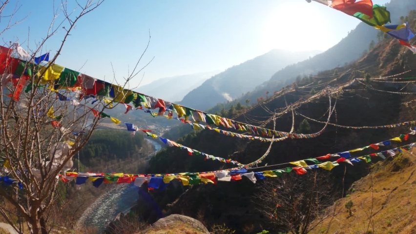 Colorful Buddhist Bhutanese Tibetan prayer flag covering the mountains at Pangan Nyingma Monastery in Patlikuhal village near Manali, Himachal Pradesh, India | Shutterstock HD Video #1073781392