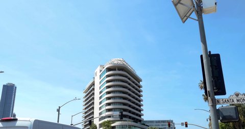 LOS ANGELES, CALIFORNIA, USA - APRIL 6, 2021: LOS ANGELES, CALIFORNIA, USA - APRIL 6, 2021: Businessmen on the roof of Waldorf Astoria Beverly Hills Hotel in Los Angeles, California, 4K - ZOOM IN