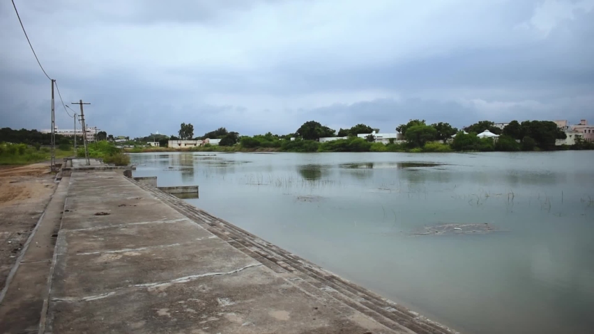 Lake With Beautiful monsoon dark Clouds In The Sky.