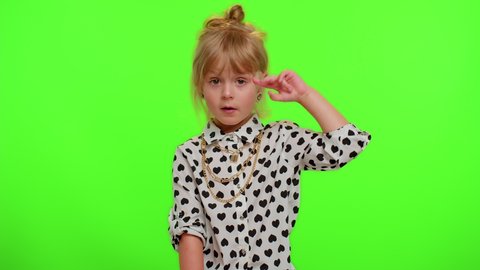 Are you crazy, out of mind? Funny blonde kid child 5-6 years old pointing at camera and showing stupid gesture, blaming some idiot for insane plan. Teenager children girl on chroma key wall background