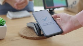 Close-up hand asia woman people work in small sme coffee café shop store owner use cashless wifi paywave nfc scan app smart pos reader sale in take out food drink order in urban city life contactless. - Powered by Shutterstock - Get 15% off with code: PIKWIZARD15