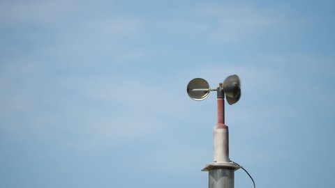 An anemometer on blue sky background
