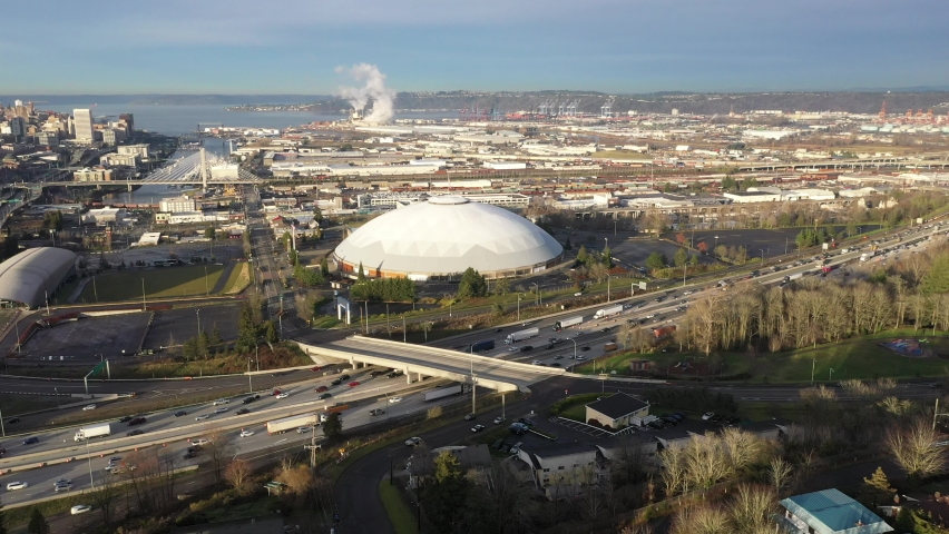 Cinematic drone shot of downtown Tacoma, harbor, dome, Commencement Bay, Puget Sound, Tacoma, a large city near Seattle in Western Washington, Pacific Northwest, economic center of Pierce County