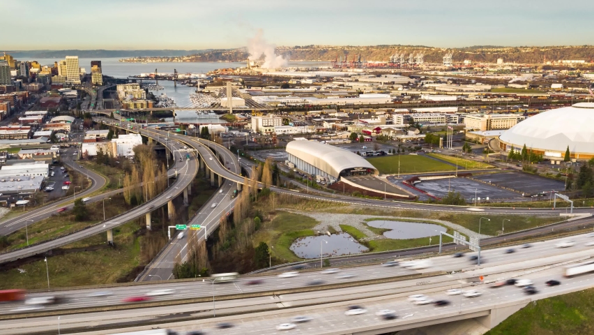 Cinematic drone time lapse shot of downtown Tacoma, waterfront, Puget Sound, a large city near Seattle in Western Washington, Pacific Northwest, an administrative and economic center of Pierce County